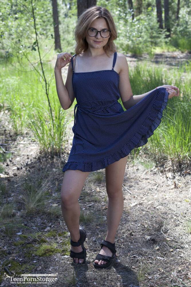 Nerdy teen Mia takes off her glasses and a dress to model naked in the woods - #8