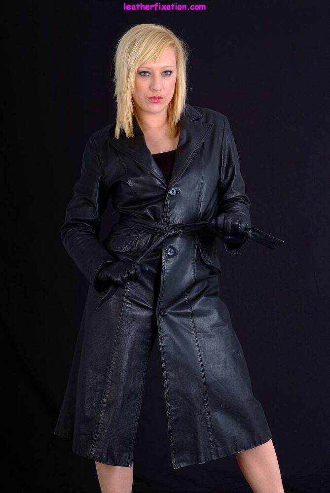 Blonde woman Axajay exposes herself in a black leather coat and gloves - #9