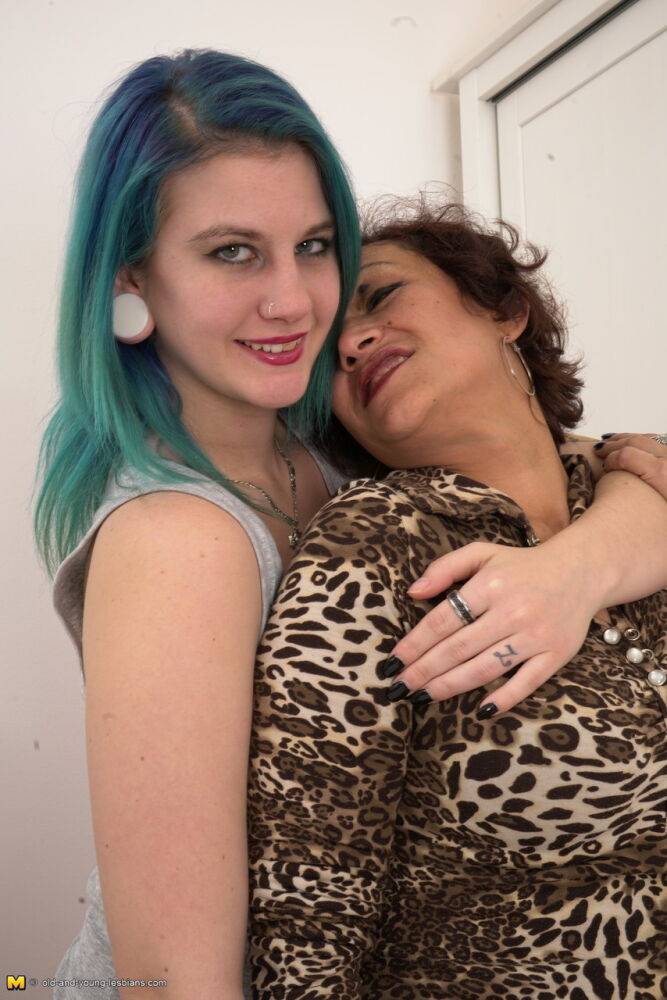 Old and young lesbians undress before a pussy licking session on a bed - #1