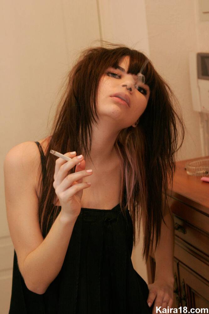 Petite teen Kaira 18 smokes a cigarette while getting naked in her bedroom - #14