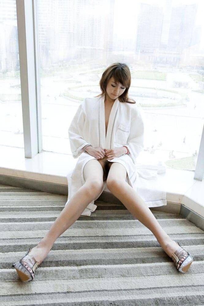 Petite Asian teen Lavinia Chan doffs a robe to pose naked on a window sill - #7