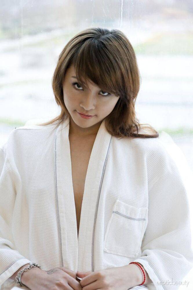 Petite Asian teen Lavinia Chan doffs a robe to pose naked on a window sill - #2