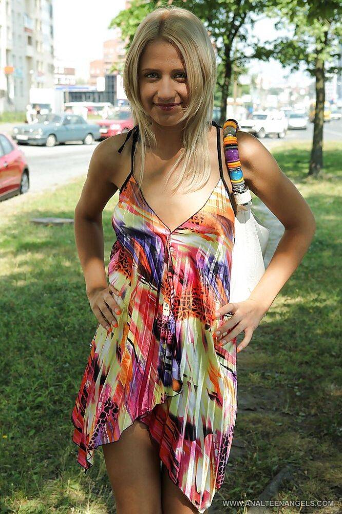 Charming teen blonde posing solo in a lovesome dress outdoor - #6