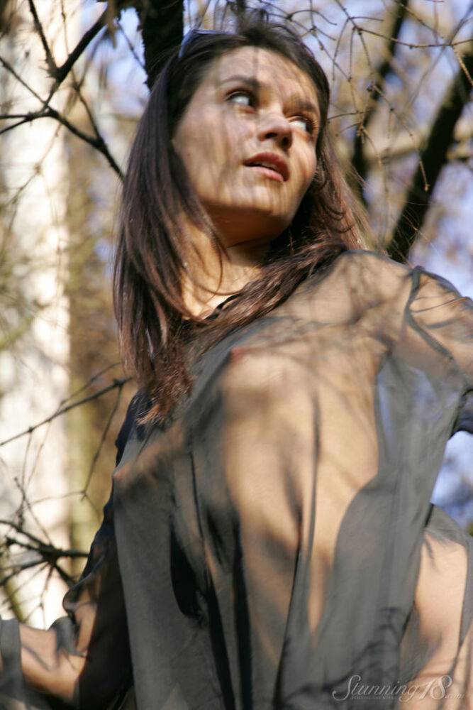 18-year-old model Roza A gets completely naked while traversing a fallen tree - #4