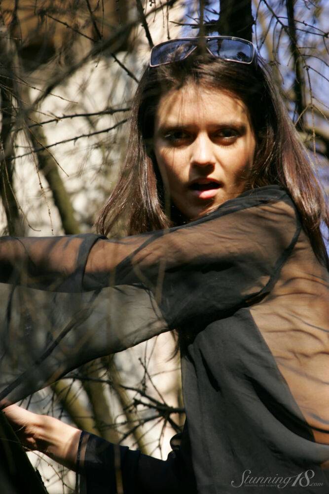 18-year-old model Roza A gets completely naked while traversing a fallen tree - #6