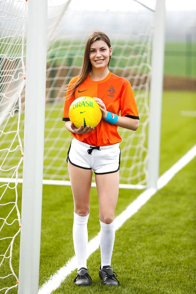 Lilly P is undressing her soccer uniform while on the field with a ball - #16