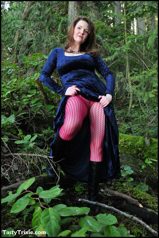 Mature woman Tasty Trixie heads into the woods to flash in a long velvet dress - #12