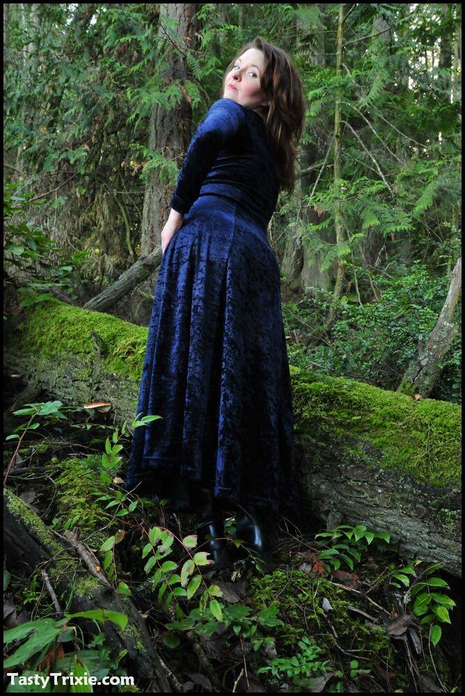 Mature woman Tasty Trixie heads into the woods to flash in a long velvet dress - #14