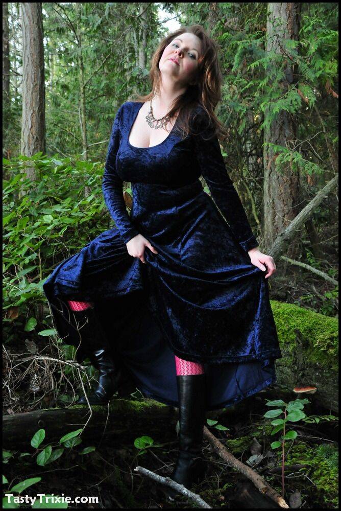 Mature woman Tasty Trixie heads into the woods to flash in a long velvet dress - #10