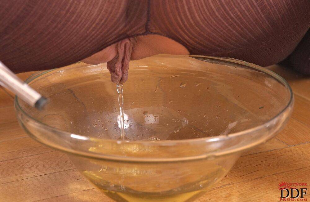 Hot chick Sandy pisses into a glass dish wearing a crotchless bodystocking - #6