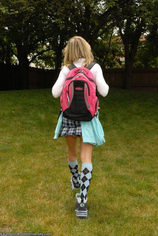 Blonde schoolgirl bares her tits and ass under a tree in knee socks and shoes - #10