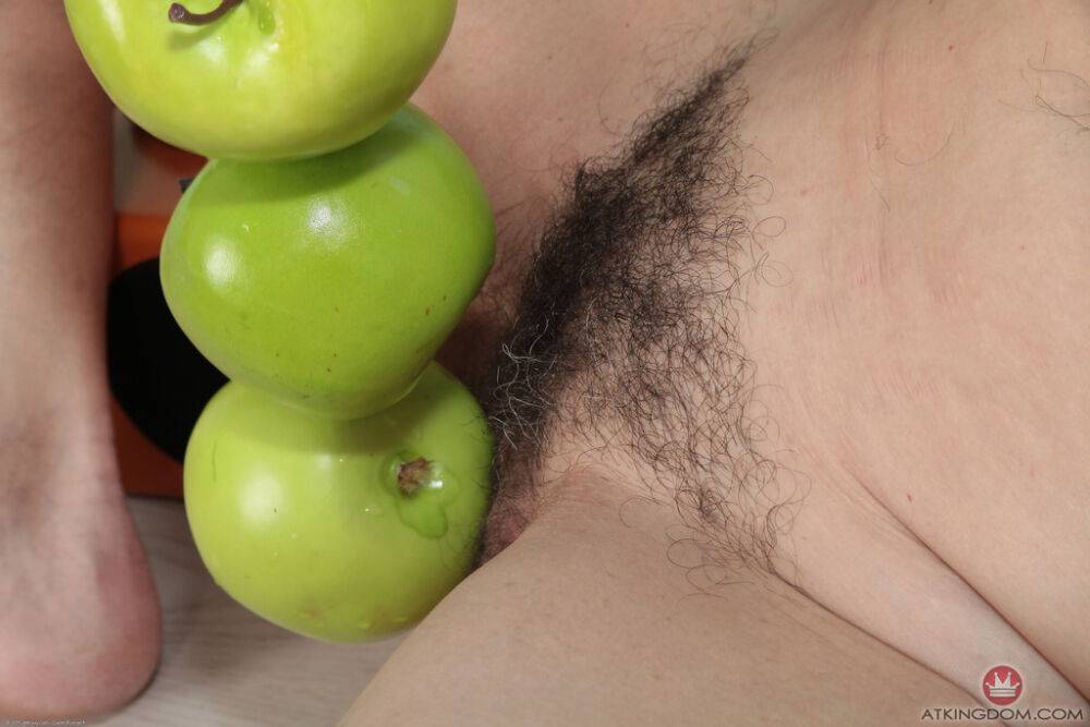 Hot mature chick Karolina plays with a bunch of apples touching her hairy twat - #15