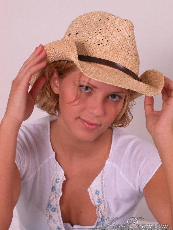 Young blonde Karen covers up her naked breasts with a straw hat in SFW action - #11