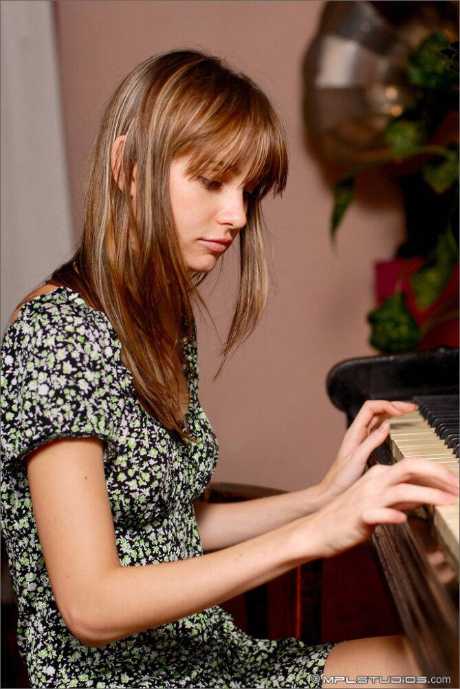 Young solo girl shows off her overly thin body on a piano bench - #2