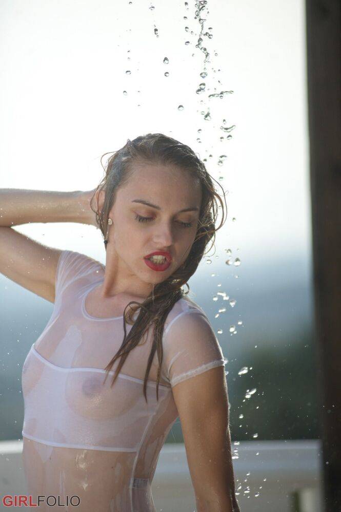 Thin teen in see thru swimsuit gets caught in a torrential downpour on balcony - #11