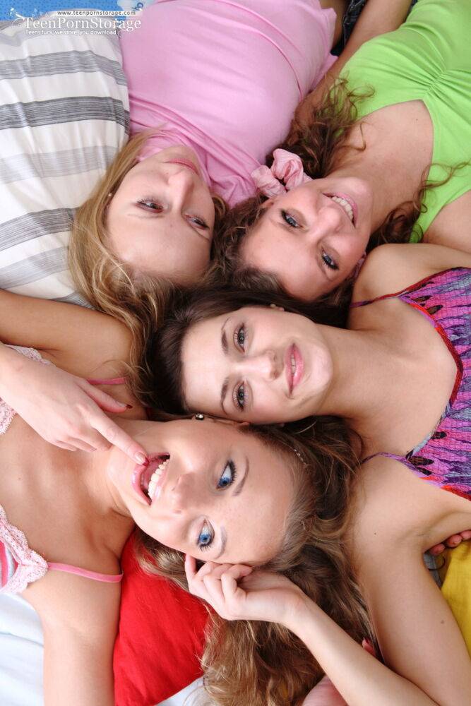 Teen girls gather on a bed before proceeding to have a lesbian foursome - #6