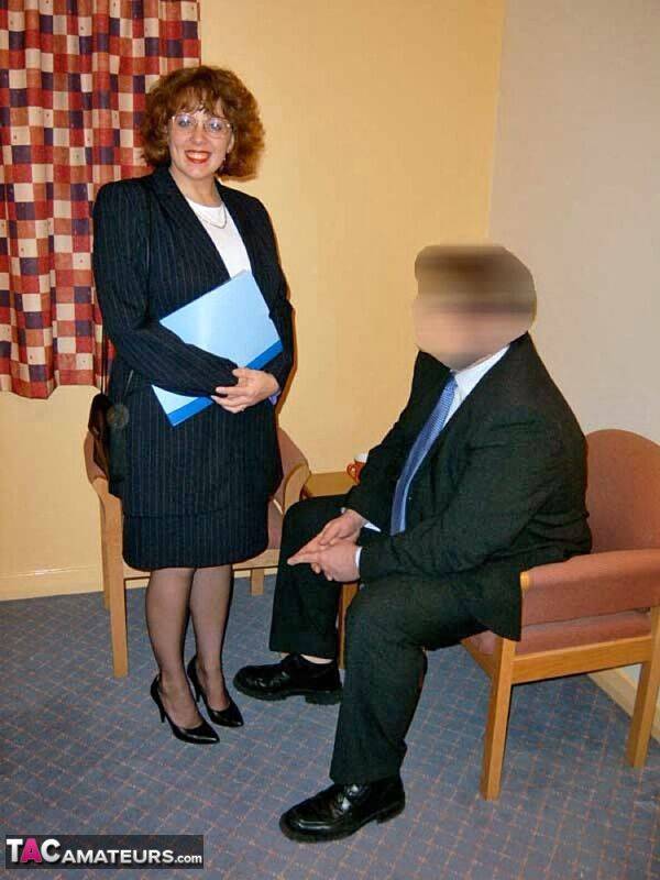 Mature British woman Curvy Claire tit smothers a businessman on a chair - #6