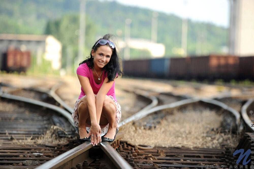 Dark-haired teen Terry Anne exposes herself in a railway yard - #13