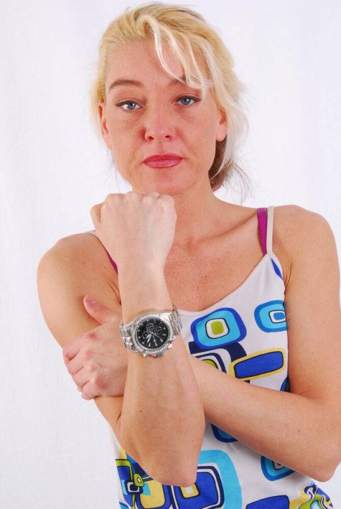 Blue-eyed blonde Lilly models a huge metal watch during safe for work action - #1