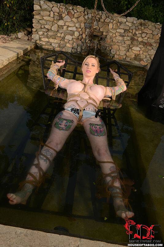 Tattooed chick Hollie Hatton is restrained and submerged in a pool of water - #13