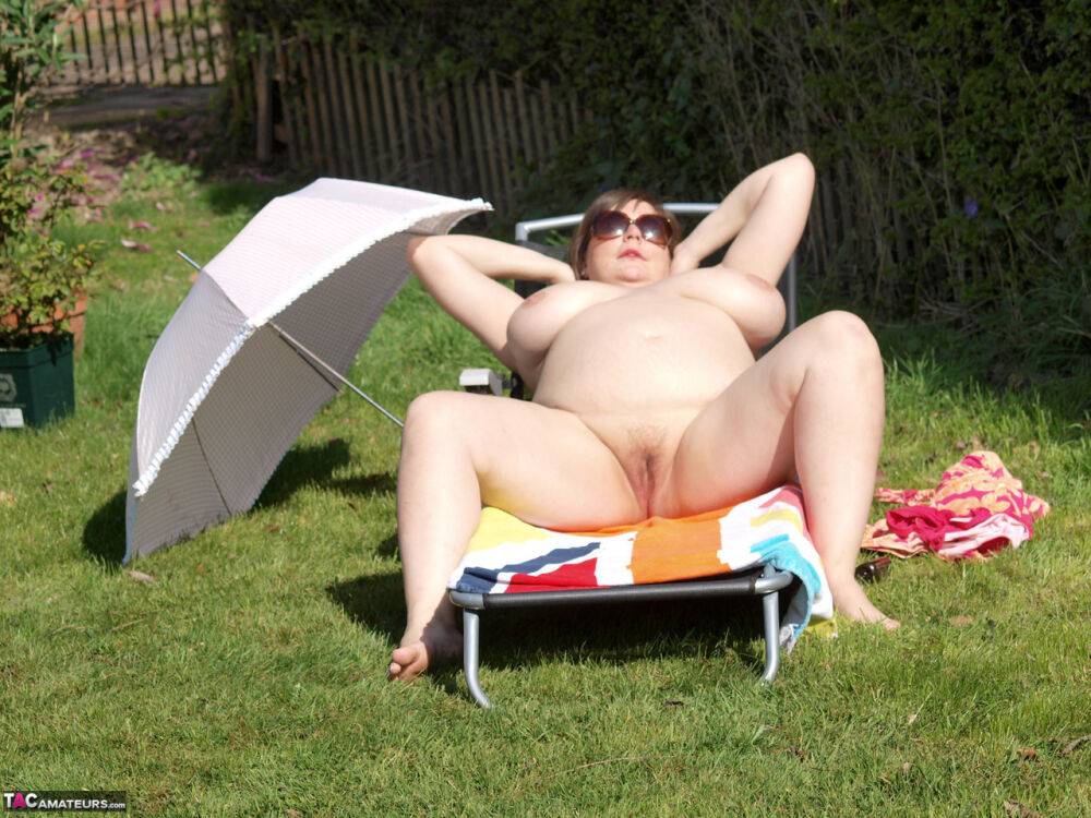 Amateur BBW Roxy gets naked in sunglasses outdoors on a lawn chair - #1