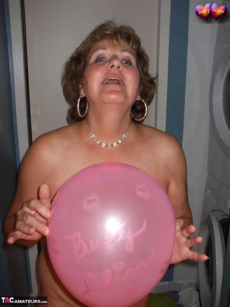 Naked mature woman Busty Bliss gets into a bathtub filled with balloons - #5