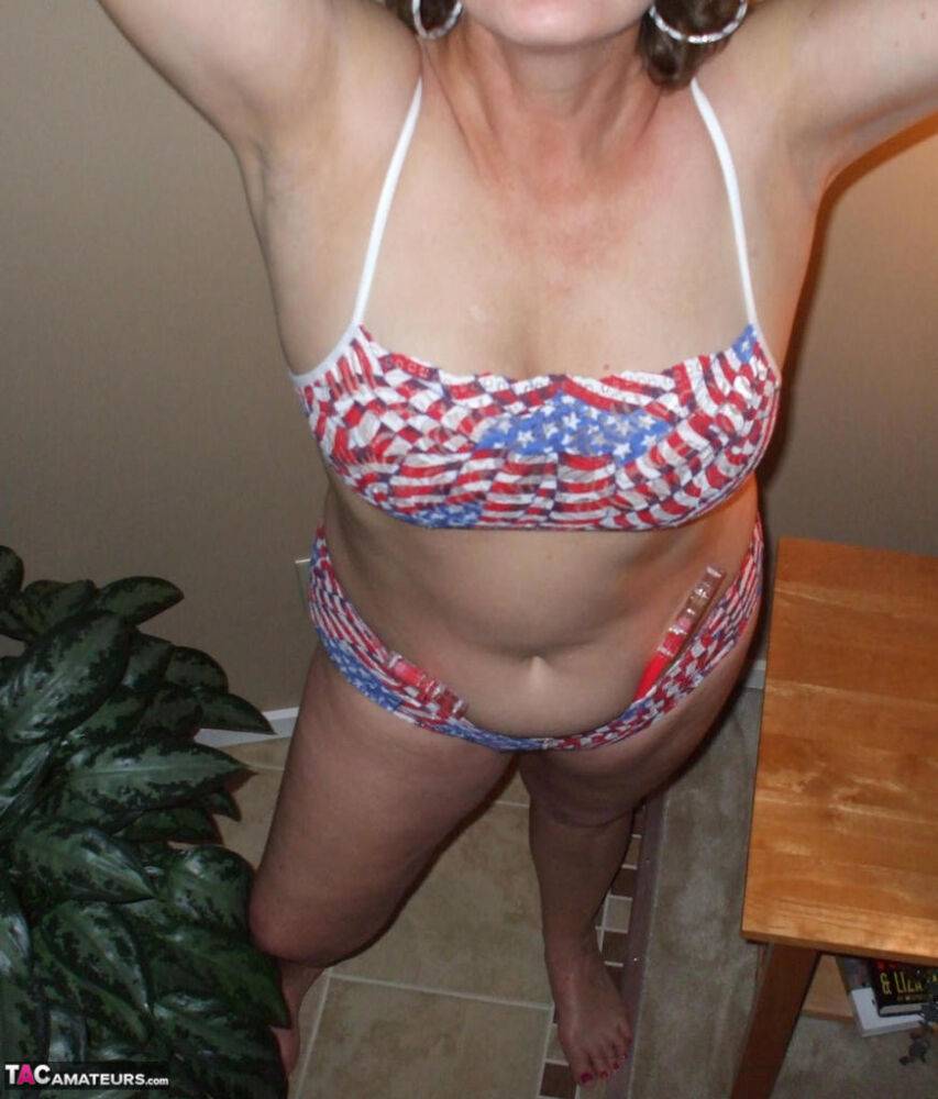 Older amateur Busty Bliss releases her natural tits from a bikini top - #8