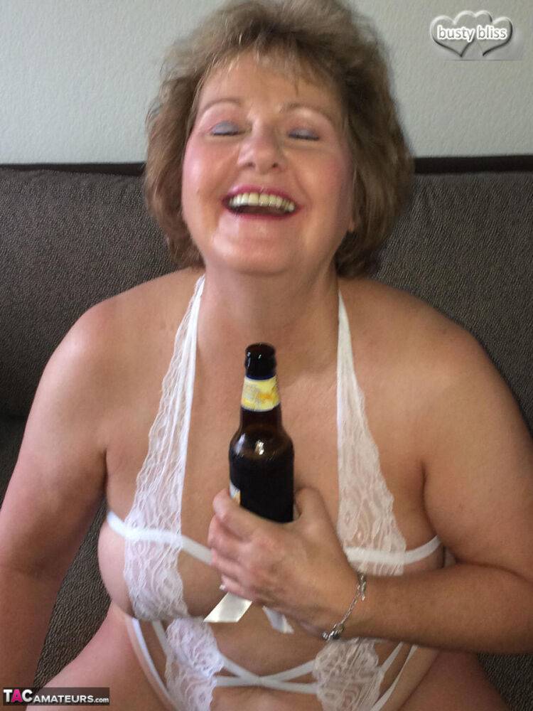 Older amateur Busty Bliss drinks a beer while wearing revealing lingerie - #3