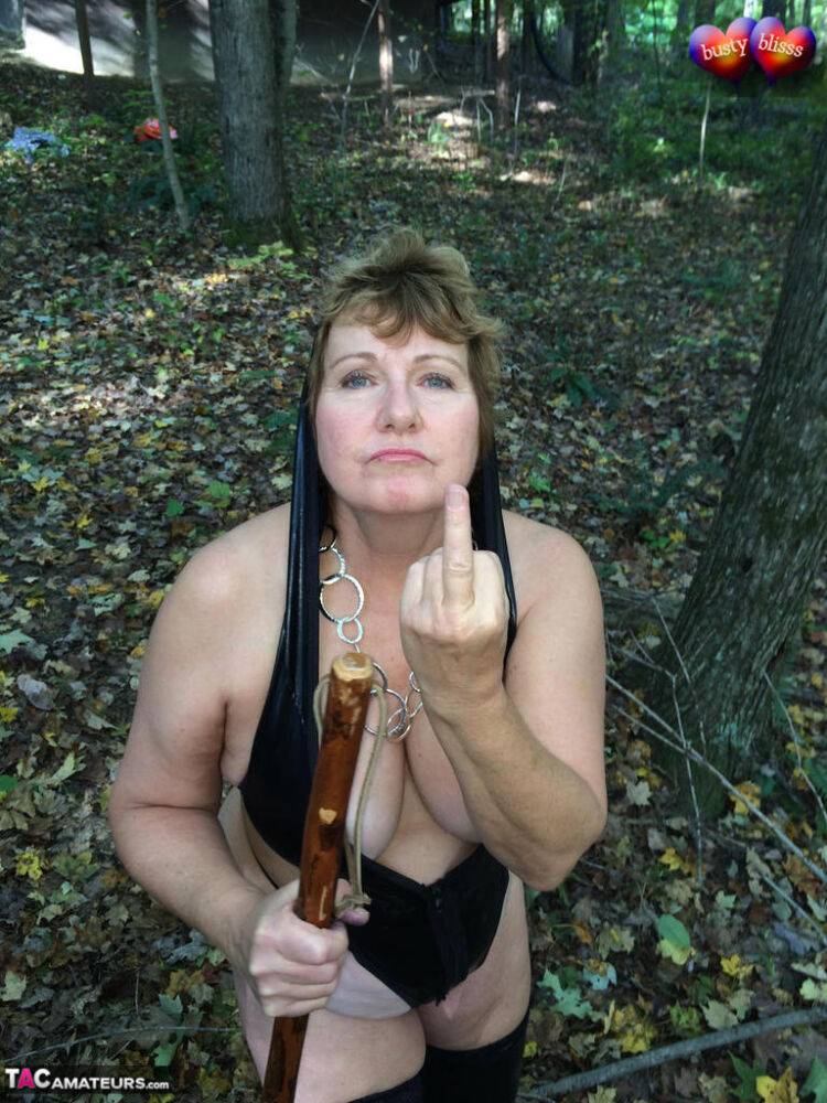 Aged lady Busty Bliss shows her tits in a forest before exposing a man's dick - #13