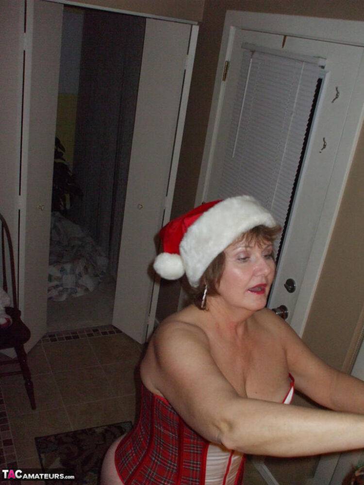 Mature amateur Busty Bliss displays her thong covered ass at Christmas - #11