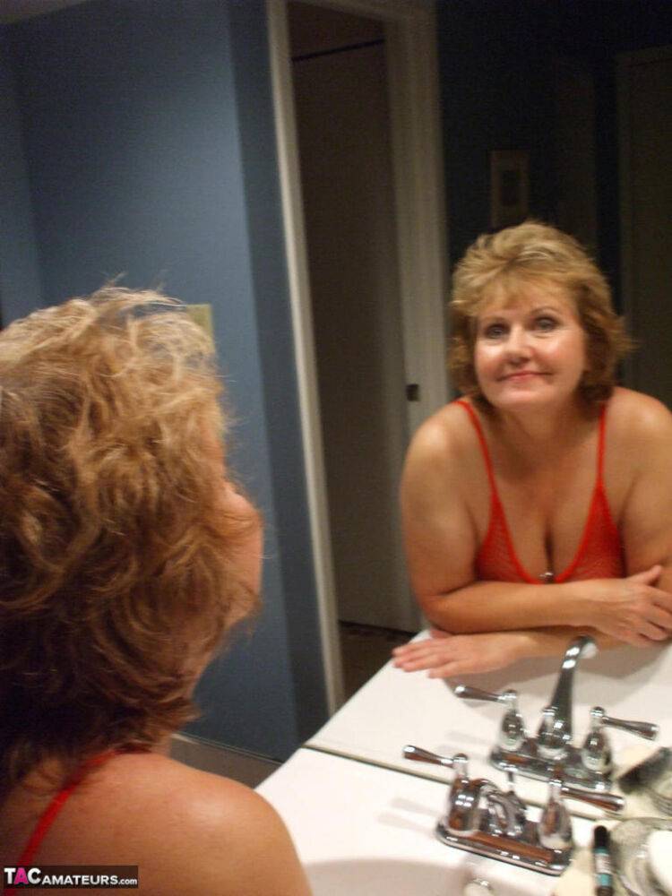 Aged lady Busty Bliss gives the bird wearing see thru lingerie in bathroom - #11