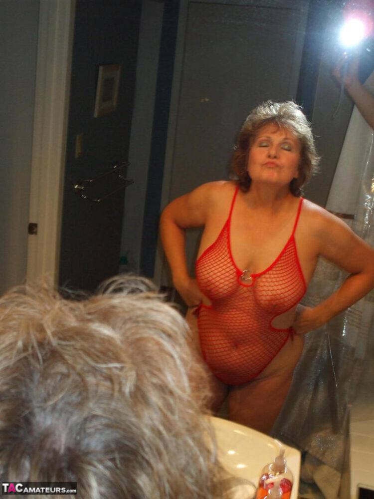 Aged lady Busty Bliss gives the bird wearing see thru lingerie in bathroom - #15