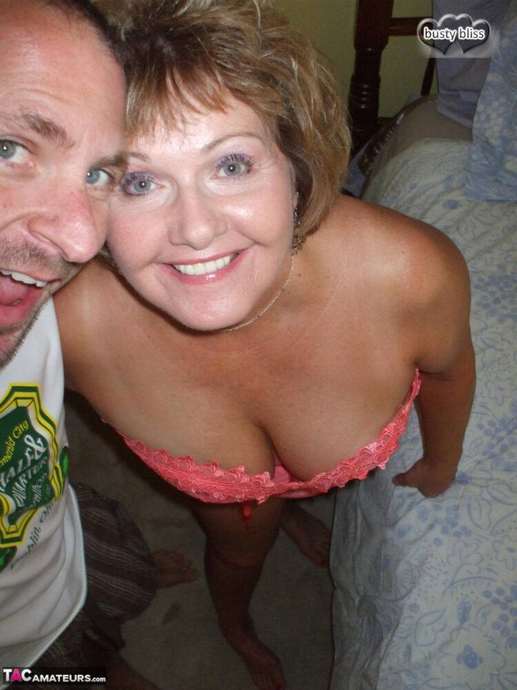 Older amateur Busty Bliss looses a boob from a laced corset over a beer - #4