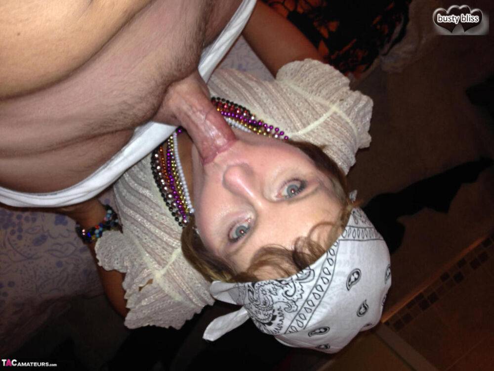 Older woman Busty Bliss gives a blowjob while drinking a beer in a skullcap - #6