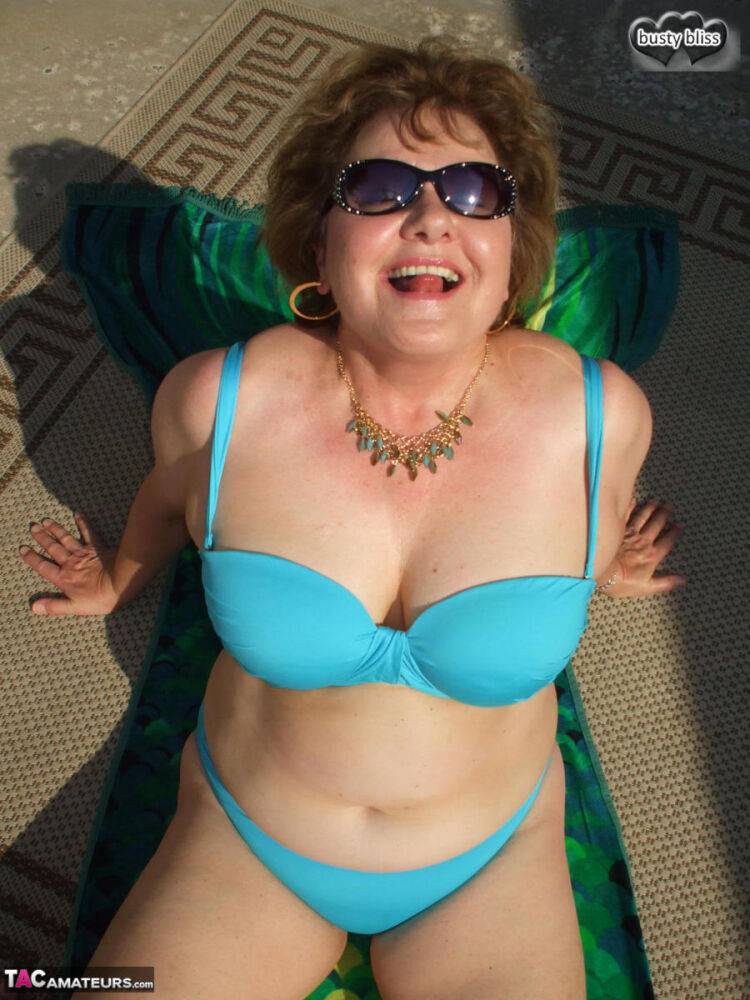 Older amateur Busty Bliss bare her natural tits while wearing sunglasses - #9