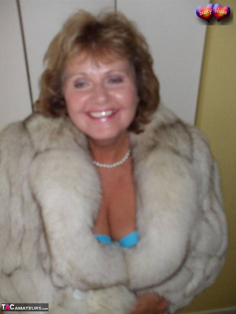 Mature amateur Busty Bliss frees her tan lined tits from a bra and fur coat - #4