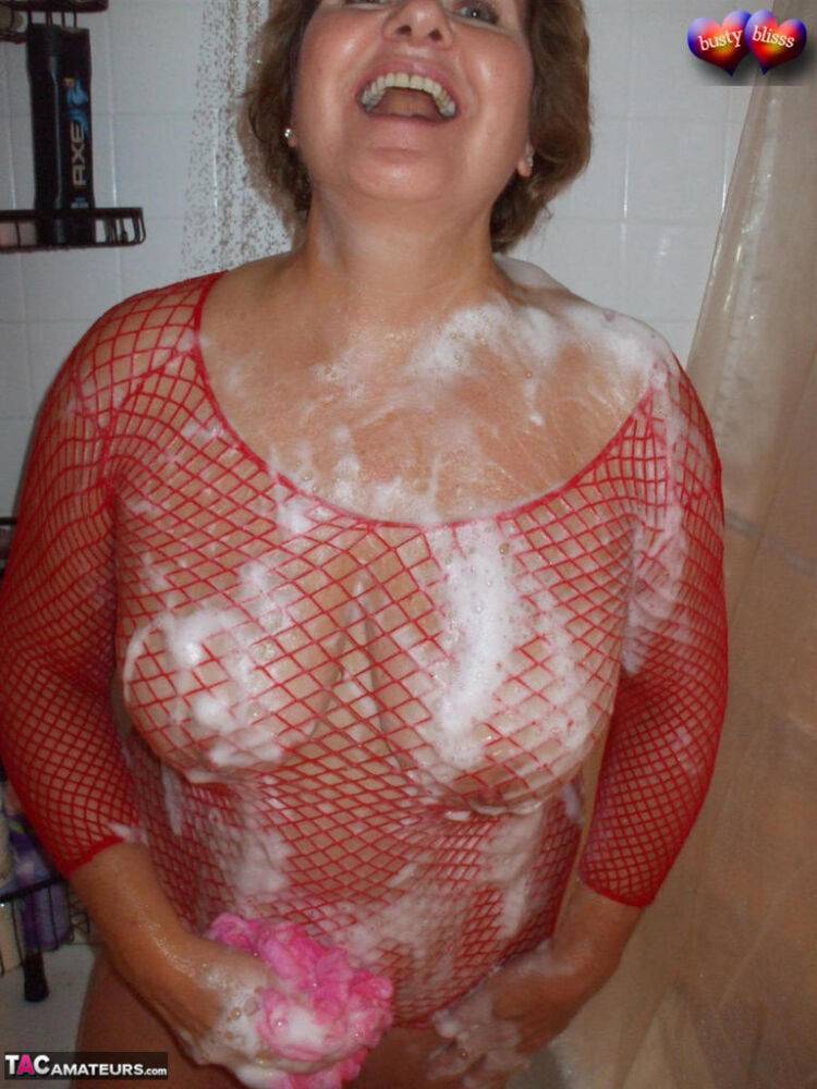 Older amateur Busty Bliss soaps up her boobs in a mesh dress - #6