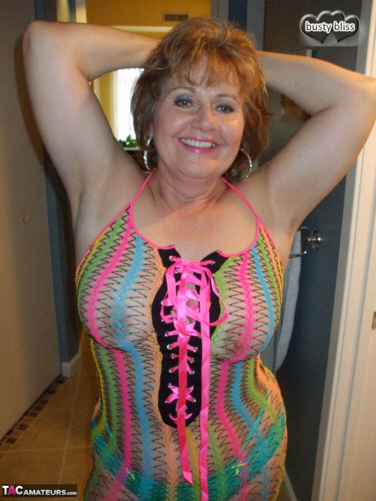 Redheaded granny Busty Bliss exposes her pussy in a see-through dress - #6