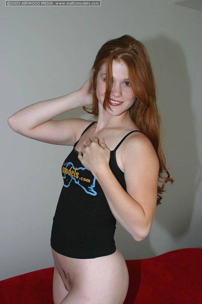 Fair skinned redhead Tiffany exposes her perky breasts in solo action - #6