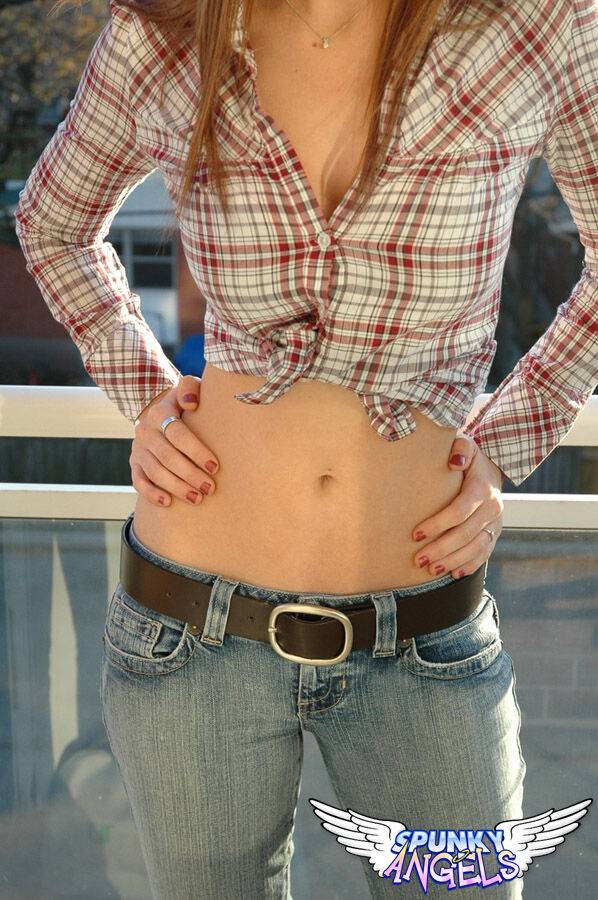 Redheaded country girl models non nude in tied up shirt and denim jeans - #12