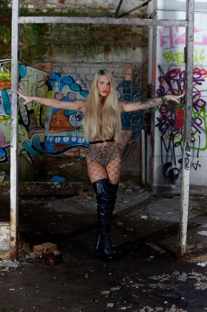 Tattooed blonde with large boobs models solo amid graffiti filled walls - #11