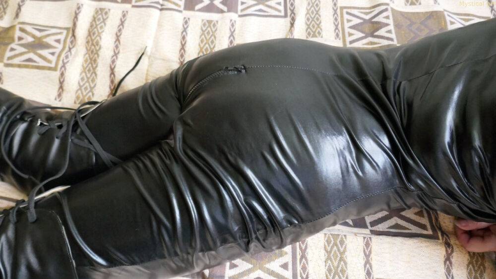 Dark-haired amateur models leather clothing and boots on a bed in shades - #5