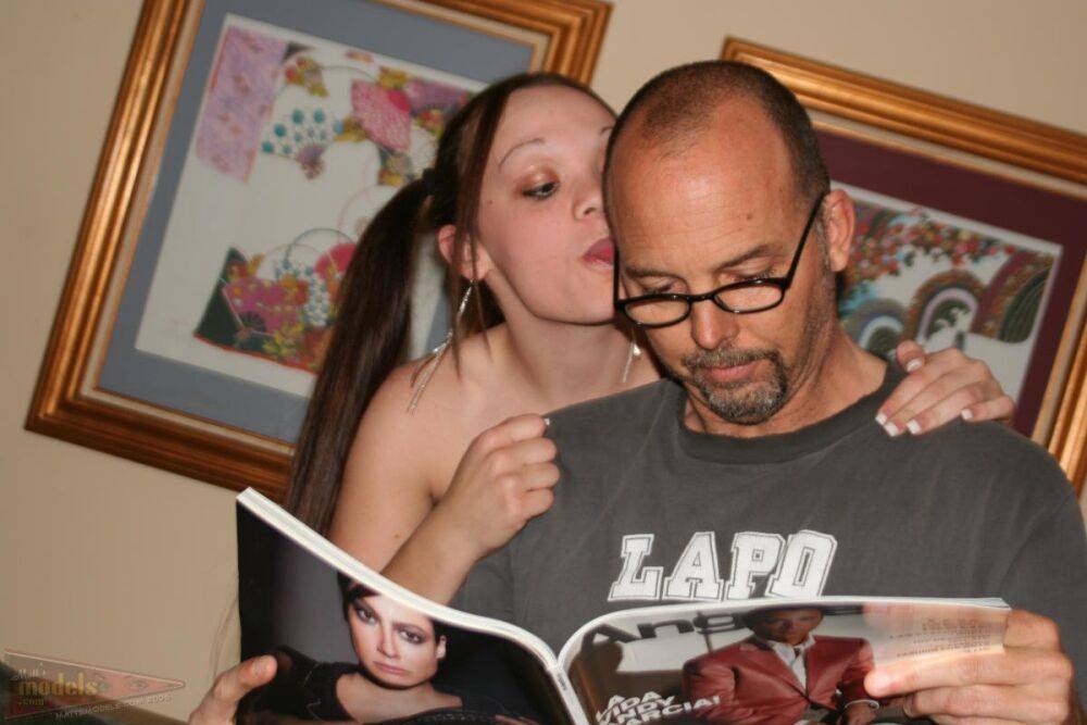 Amateur chick Krystal reads a magazine while sitting naked on a man's lap - #11