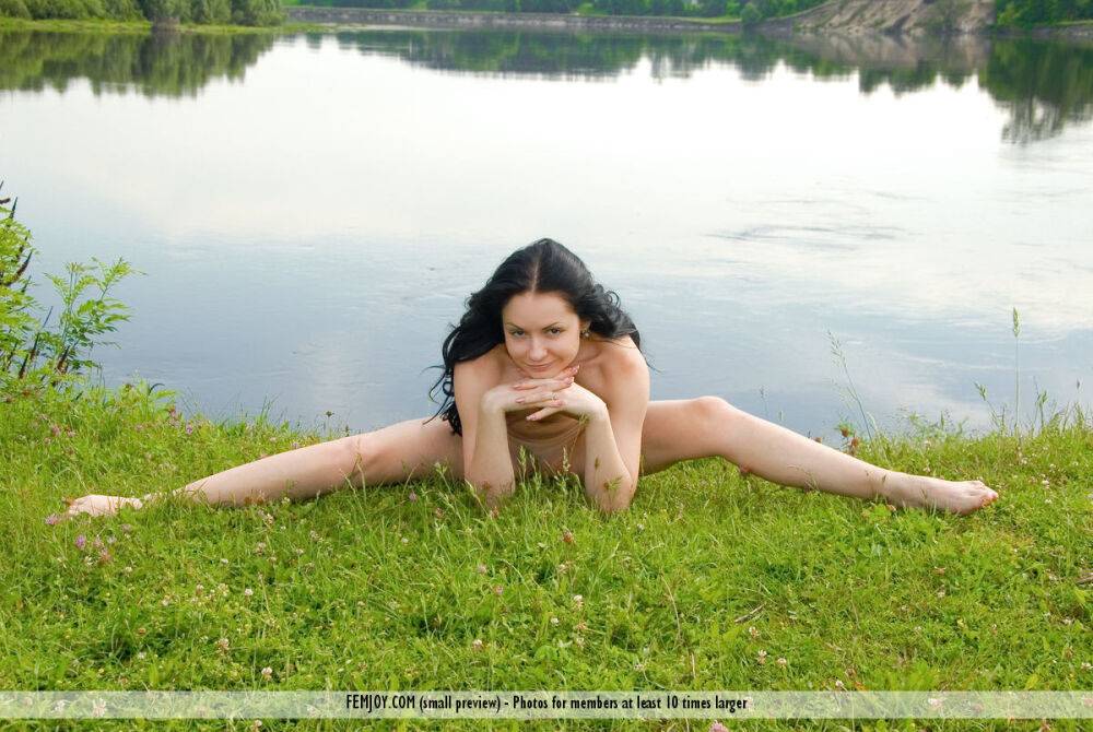 Solo girl with black hair Marliece models totally nude near calm waters - #6