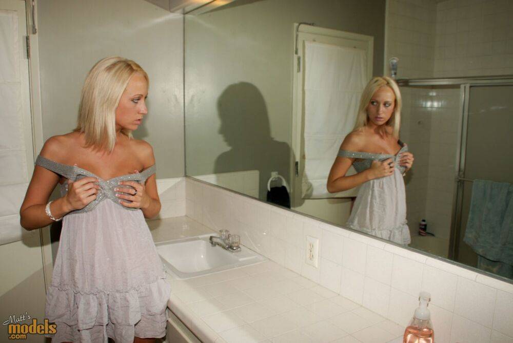 Blonde amateur Torrie admires her naked body in a bathroom mirror - #8