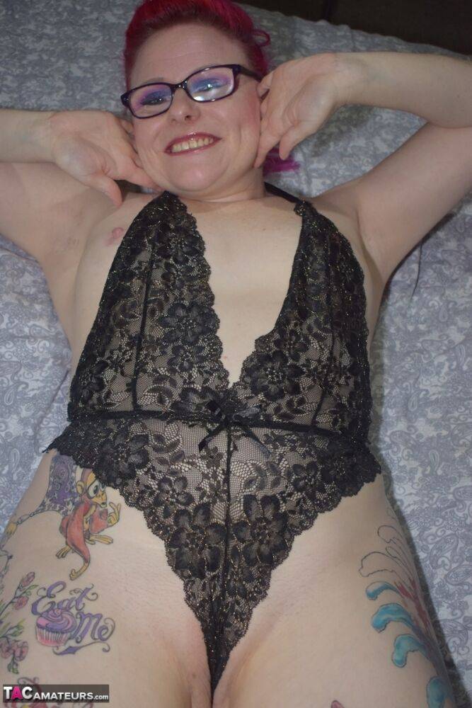 Tattooed redhead Mollie Foxxx models black lingerie with her glasses on - #10