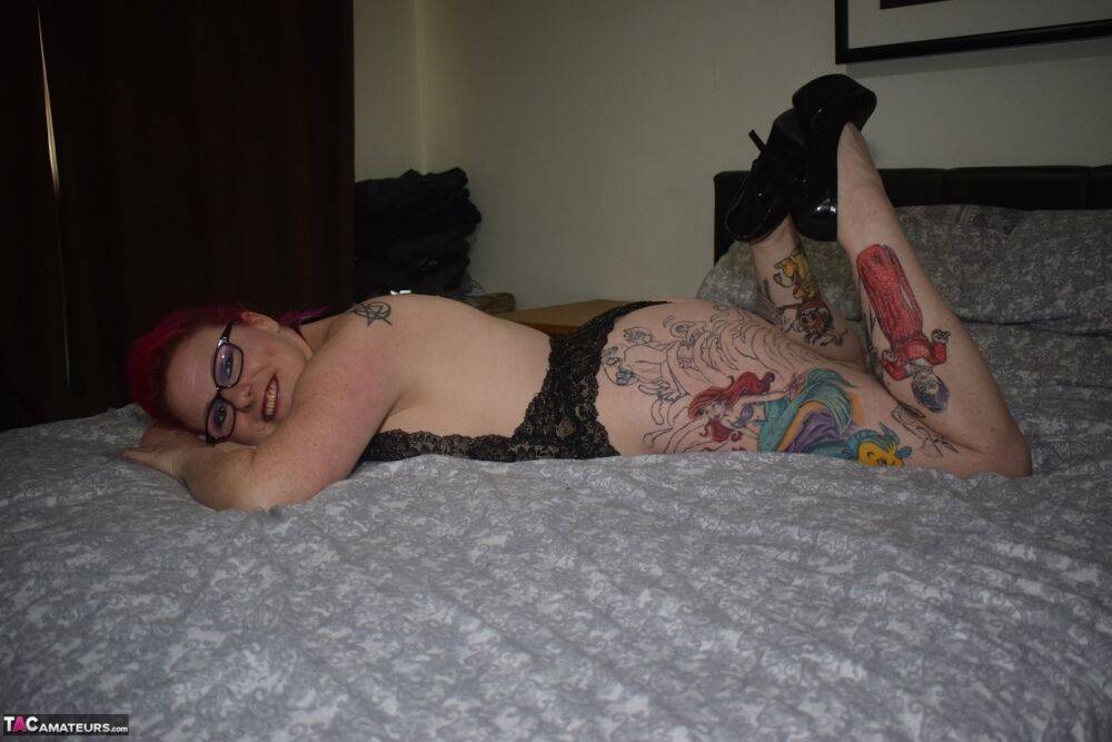 Tattooed redhead Mollie Foxxx models black lingerie with her glasses on - #16