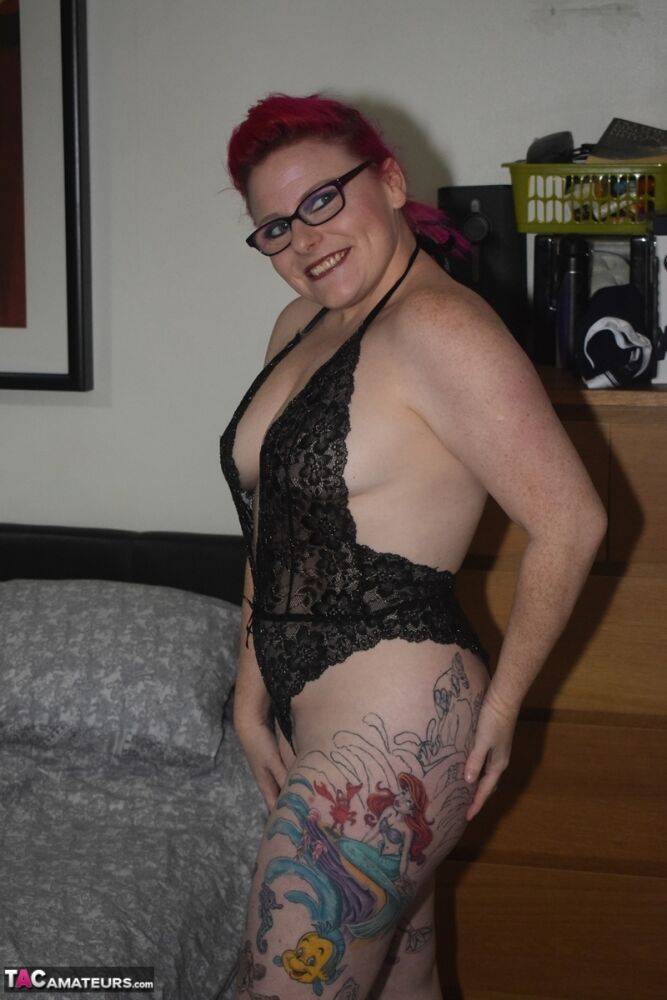 Tattooed redhead Mollie Foxxx models black lingerie with her glasses on - #13