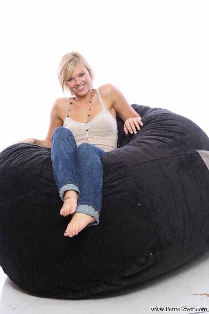 Blonde amateur models non nude on a bean bag chair in blue jeans - #1