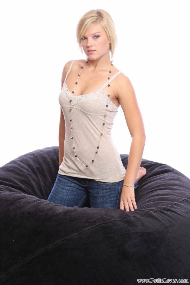 Blonde amateur models non nude on a bean bag chair in blue jeans - #15